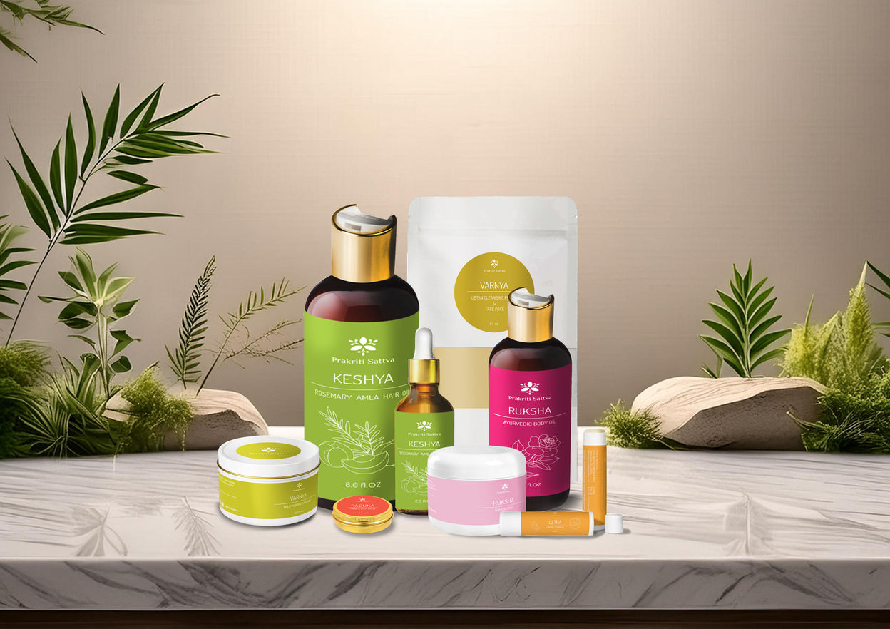Prakriti Sattva Ayurvedic Natural Skin Care and Hair care products like hair oil, body oil, face mask, body butter, repair balm and lip balm lined up with a nice natural background.