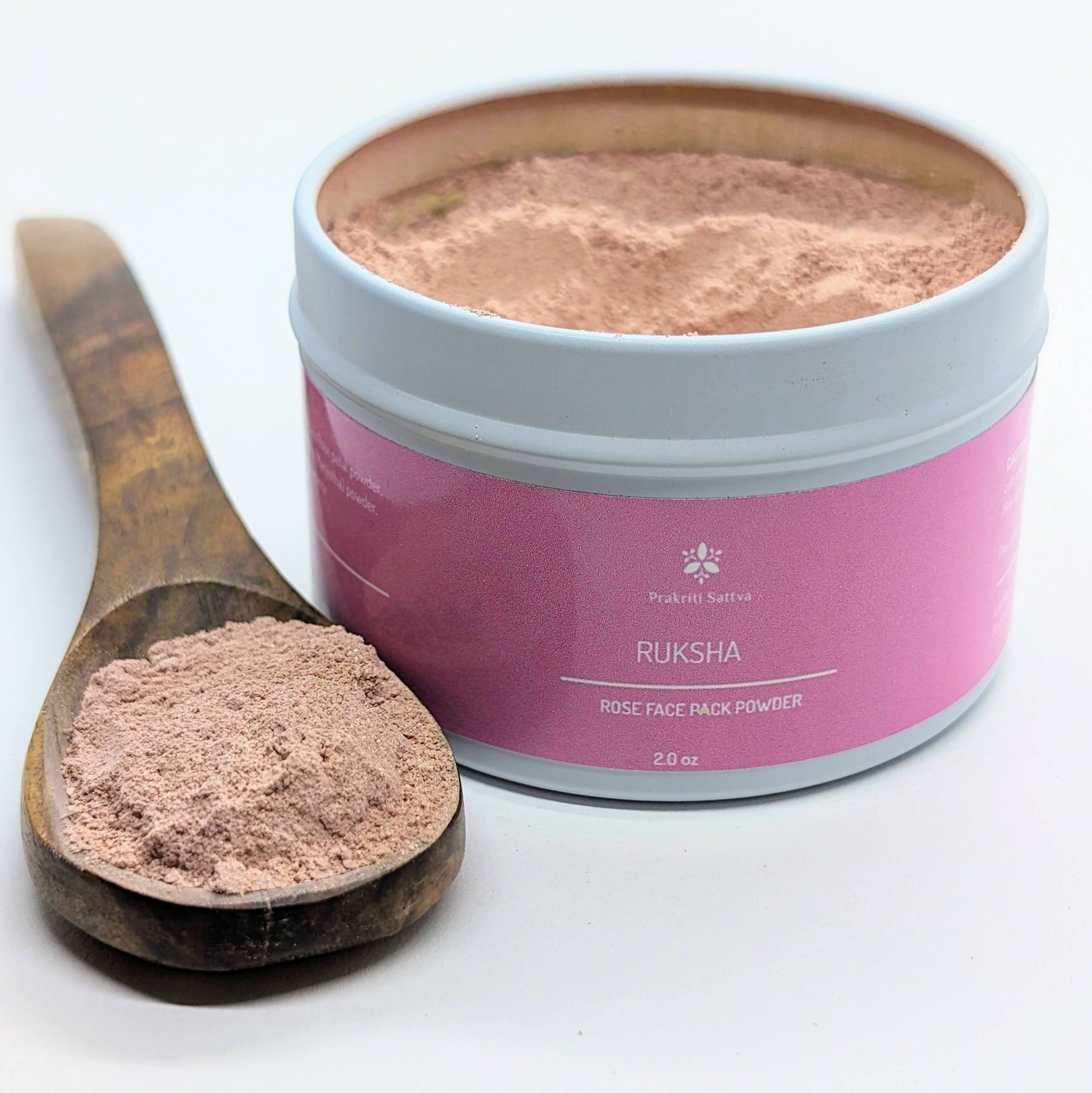 Ayurvedic Natural Rose Face mask , rose face pack. Ayurvedic Natural Rose Face mask , rose face pack. A two ounce jar of pink-hued face pack powder, perfect for natural skin care. The label features Ayurvedic symbols and herbs, including rose, colloidal oatmeal, French pink clay, hibiscus petals, licorice root, coconut milk, aloe vera, and essential oils, indicating the natural ingredients used.