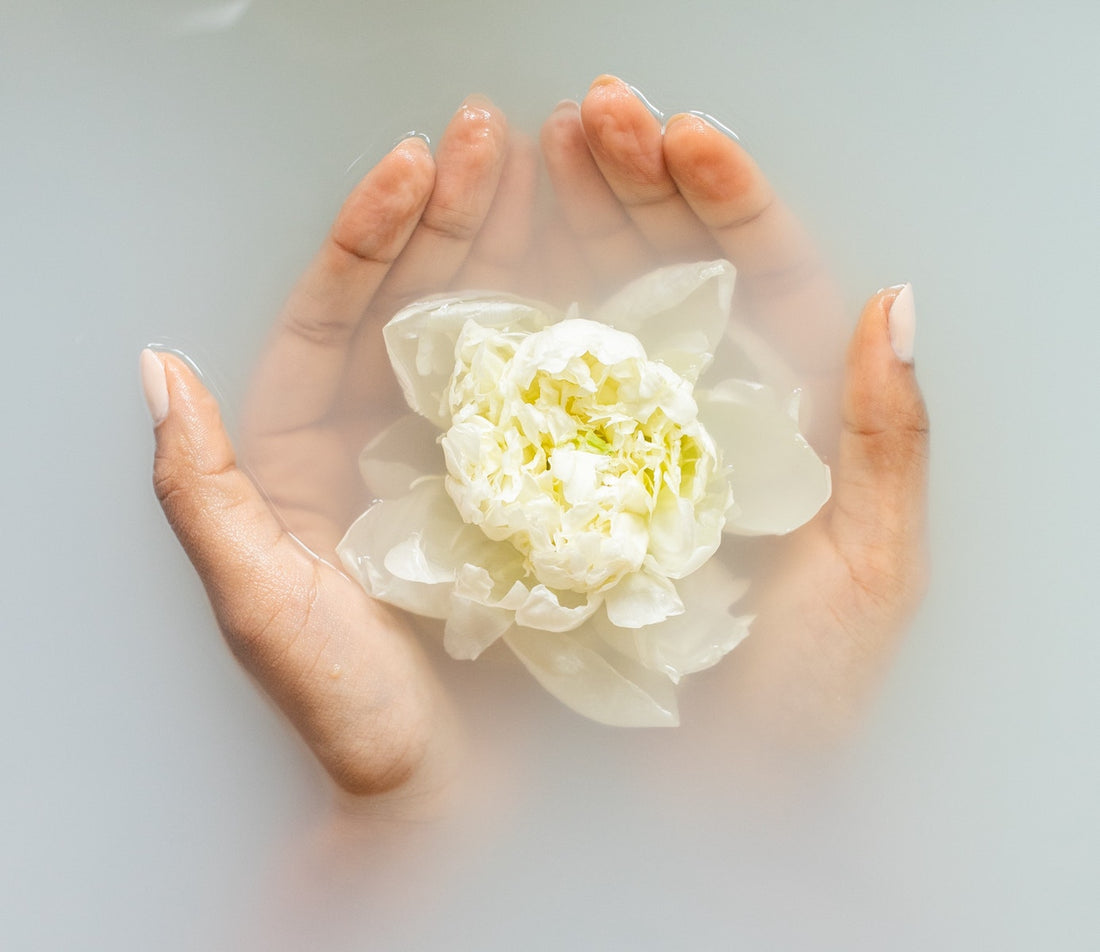 Natural flower in cupped hands - Prakriti Sattva Benefits of Natural Body Care products