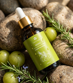 Prakriti Sattva Keshya Rosemary Amla Ayurvedic hair oil amber glass dropper bottle with green label on stones and gooseberries background