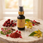 A bottle of Prakriti Sattva Glow & Bighten Serum stands on a marble surface with a small bowl of reddish manjistha (Indian madder root) powder, red rosehip berries, Licorice sticks, and yellow flowers around it.