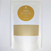 Ayurvedic Ubtan natural powder refill pouch.
Prakriti Sattva Ayurvedic Ubtan Powder. A jar of orange-hued powder, perfect for natural face and body cleansing and scrubbing. The label features Ayurvedic herb powders like mung bean flour, besan / chickpea flour, rice flour, neem, licorice, rose, indicating the natural ingredients used.