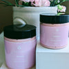 Prakriti Sattva eight ounce and four ounce pink body butter in a plastic jar with black lid. The jar is filled with a creamy, textured body butter product.
