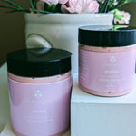 Prakriti Sattva eight ounce and four ounce pink body butter in a plastic jar with black lid. The jar is filled with a creamy, textured body butter product.