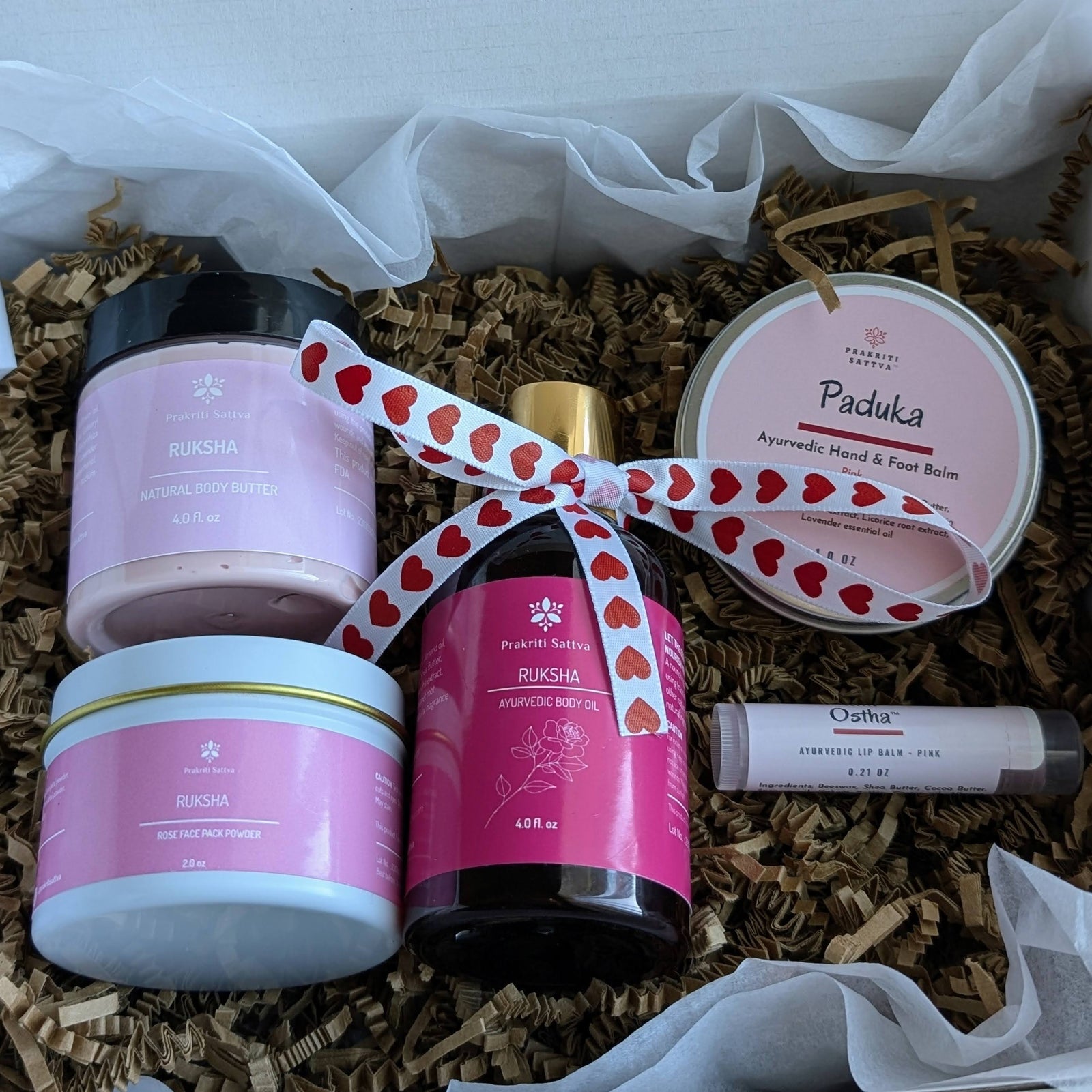 Prakriti Sattva Valentine's Day Gift box, Gift set containing natural body butter, Rose face pack powder mask, natural body oil, Cracked heel and hand balm, lip balm or lip tint.