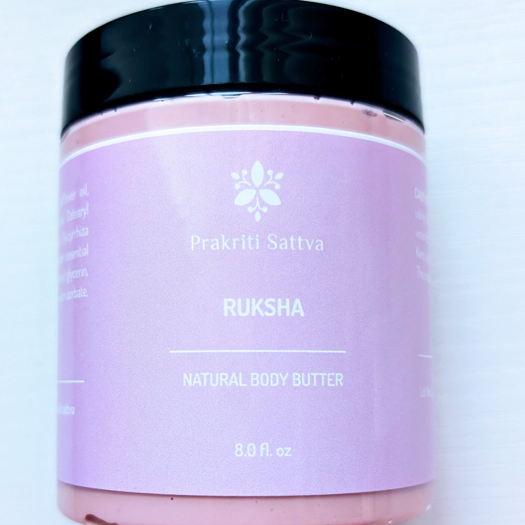 Prakriti Sattva 8-ounce pink body butter in a plastic jar with black lid. The jar is filled with a creamy, textured, pink body butter product