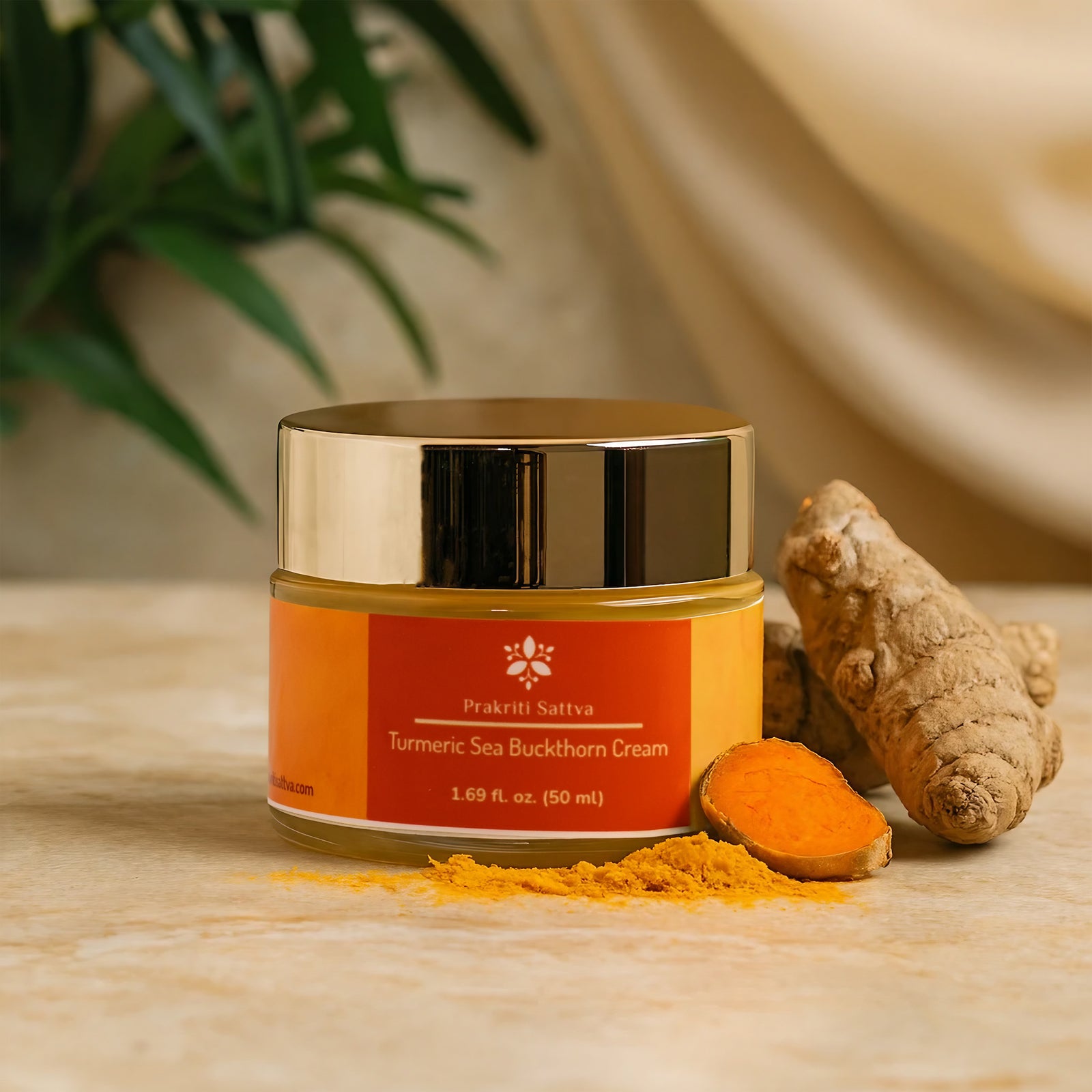 Jar of Prakriti Sativa Turmeric Sea Buckthorn Cream with turmeric root and powder on a wooden surface.